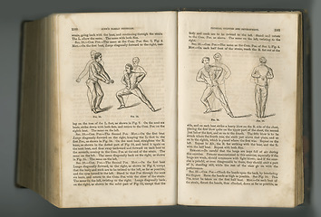 Image showing Old book, vintage pages and fitness guide, antique manuscript or ancient scripture of exercises in literature against a studio background. Closeup of historical novel, journal or workout in history