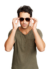 Image showing Handsome man, portrait and sunglasses in fashion, cool style mindset or attitude against a white studio background. Face of attractive young male person or model posing in stylish casual clothing