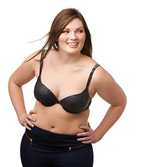 Image showing Thinking, smile and bra with a plus size woman in studio isolated on a white background for body positivity. Idea, vision and a happy young model looking natural or confident in her underwear