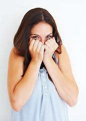 Image showing Excited, hiding and portrait of shy woman with playful energy in white background of studio. Happy, emoji and person with hands to cover face for gossip story, information or reaction to drama