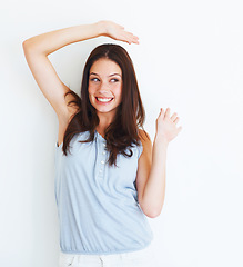 Image showing Excited, woman and dancing with freedom in studio, white background and mockup space. Happiness, celebration and person with a smile for creativity or hands with energy or movement on backdrop