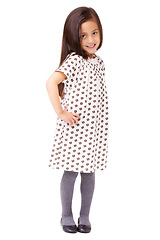 Image showing Happy, child or portrait with smile or fashion on white background in studio with confidence. Hands on hips, cute female kid or full body of young girl in Italy with dress, pride or clothes in style