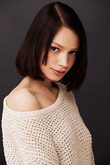 Image showing Beauty, jersey and portrait of woman on dark background for fashion, winter style and trendy clothes. Confidence, shoulder and face of natural person with sweater for cozy, comfort and warm in studio