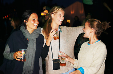 Image showing Woman, beer outdoor at night or music festival in forest adventure, nature celebration or group connection. Friends, face and smile for alcohol drinking or dancing techno for summer, travel or crowd