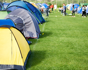 Image showing Music festival, camping and tents in park with people in summer, holiday or field at concert in countryside. Camp, site or adventure shelter on grass in woods or group at carnival in morning of rave