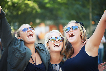 Image showing Friends, outdoor and women with hug, dancing and nature with happiness, excited and cheerful. Group, people and party with music festival, concert and energy with culture, environment and smile