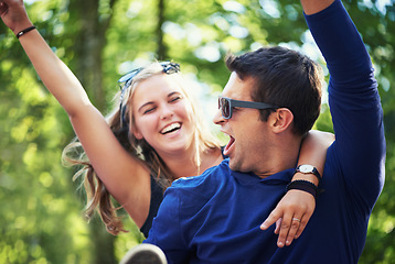 Image showing Piggyback, dance or happy couple in nature on holiday vacation to relax with smile in park together. New year, man screaming or excited woman with freedom, connection or energy for fun celebration