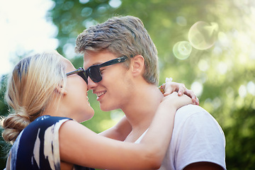 Image showing Happy couple, holiday or hug for love in park, nature or outdoors on a romantic date for support. Wellness, relationship or man with woman, smile or trust for kiss, care or freedom together outside