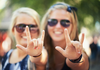 Image showing Rock, hands or portrait of friends in music festival on holiday vacation together to relax with smile. Party, reunion celebration or excited gen z women with devil horns for a fun memory or event