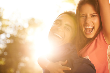 Image showing Love, energy and portrait of happy couple in a park with piggyback, fun or bonding together. Freedom, face and excited people in a forest for back ride, support and adventure in the woods at sunset