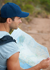 Image showing Man, hiking and map for direction, guide and nature or trail, fitness and exercise on holiday. Male person, lost and documents for information, travel and journey or adventure to forest for cardio