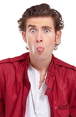 Image showing Silly, tongue out and portrait of a man with funny joke and comedy face gesture in a studio. Modern, quirky and hipster fashion of a male model with fun and playful in a white background with outfit