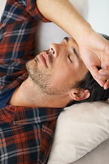 Image showing Rest, sleeping and man on sofa in home for afternoon nap, relax and calm in living room. Asleep, eyes closed and face closeup of tired person on couch lying for fatigue, comfortable and wellness