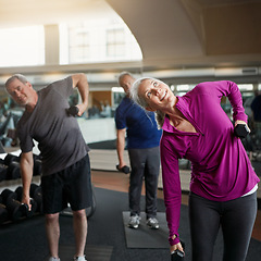 Image showing Senior fitness, stretching people with dumbbells at gym for training, wellness or cardio exercise. Class, workout and elderly men with personal trainer for weightlifting club, support or bodybuilding