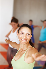Image showing Fitness, smile and yoga class with an instructor in a studio for health, wellness or holistic training. Exercise, pilates or stretching with a yogi teaching students about zen, balance or inner peace