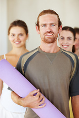 Image showing Portrait, yoga or exercise mat and man with a group of people in a studio for health, wellness or mindfulness. Fitness, training and pilates with happy young friends in gym class for holistic balance