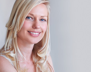 Image showing Portrait, beauty and smile of woman in hair care at studio isolated on a white background mockup space. Face, happy blonde model and hairstyle in salon treatment, healthy cosmetics and natural skin