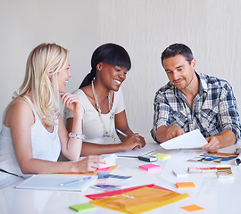 Image showing Brainstorming, smile and team of business people with photograph at table in meeting together, cooperation or collaboration in startup. Happy, creative group or designers on picture planning strategy