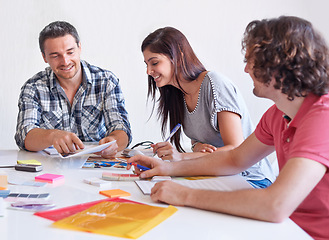 Image showing Brainstorming, smile or creative group of business people at table in meeting together, planning strategy or collaboration in startup. Happy, team or designers on picture for project choice in office