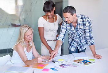 Image showing Teamwork, creative and business people planning at table in meeting, decision or collaboration in office startup. Happy group, designer and color swatches on picture or brainstorming palette together