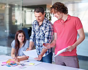 Image showing Teamwork, creative and business people brainstorming at table in meeting, cooperation and collaboration in office startup. Group, designer and color swatches, photograph or planning strategy together