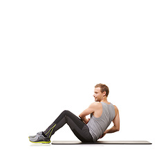 Image showing Man, medicine ball and twist on mat for training exercise in studio on white background, fitness or workout strength. Male person, sports equipment and stomach abs challenge, wellness or mockup space