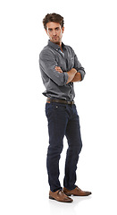 Image showing Man, arms crossed and studio portrait with fashion, trendy style and shirt with confidence by white background. Person, guy or model with cool denim jeans, edgy clothes and pride from Argentina