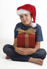 Image showing Sitting boy with Christmas Gift