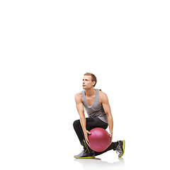 Image showing Man in studio with fitness, gym ball and mockup for exercise, body wellness and commitment. Workout, muscle training and athlete with sphere for balance, stability and performance on white background