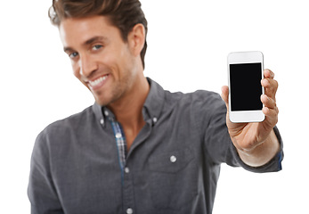 Image showing Business man, portrait and phone screen for advertising space, presentation or mobile newsletter in studio on white background. Happy worker, smartphone mockup or review sales information coming soon