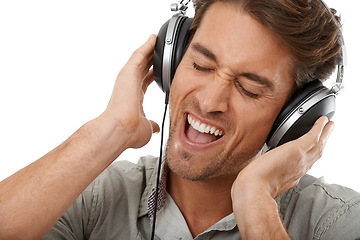 Image showing Man, headphones and singing music in studio for audio subscription, multimedia sound and party on white background. Face, excited model and karaoke singer with radio, podcast and streaming at mockup