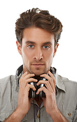 Image showing Man, music headphones and serious portrait in studio for audio subscription, streaming multimedia or radio on white background. Face of model listening to podcast, hearing sound and playlist of album