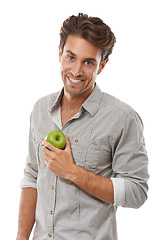 Image showing Portrait, smile and man with apple, food and healthy diet isolated on a white background in studio. Face, happy person and green fruit for nutrition, vegan and wellness benefits, vitamin c or organic