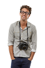 Image showing Portrait, man and photographer with camera on neck in studio isolated on a white background. Happy person in glasses, creative paparazzi and fashion of confident model with hands in pocket in Spain