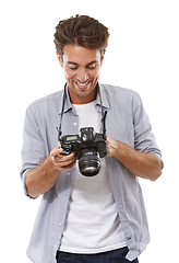 Image showing Smile, man and photographer with camera in studio isolated on a white background. Happy person, creative paparazzi and dslr, lens or technology for hobby, picture model and professional cameraman
