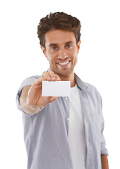 Image showing Portrait, happy and man with business card, mockup and advertising space isolated on a white studio background. Face, person and show paper for promotion, info and commercial, marketing or hand sign