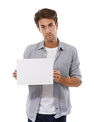 Image showing Portrait, sign and man on poster, advertising and mockup space isolated on a white studio background. Serious face, paper and show banner for promotion, info or commercial, marketing or presentation