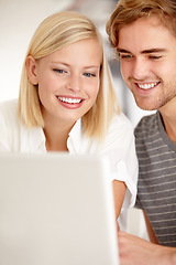 Image showing Laptop, smile and love with a young couple in their apartment for planning or investing together. Computer, online or ecommerce with a happy man and woman in the home for portfolio, website or growth