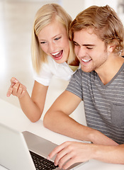 Image showing Laptop, excited and investment with a young couple in their apartment for online shopping or planning together. Computer, bank or pointing with a happy man and woman in the home for portfolio growth