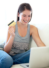 Image showing Woman, credit card and laptop on sofa for online shopping sale, e commerce discount or cashback bonus at home. Excited person on couch and internet banking, web registration and typing on a computer