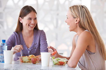 Image showing Salad, friends or women at lunch for happiness or smile on break to relax together for funny joke. Conversation, healthy or colleagues laughing at table in cafeteria for eating fruit or communication