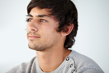 Image showing Thinking, face and man in studio for ideas, choice and decision of questions, insight or future memory on white background. Curious young model daydream of vision, inspiration or remember why in mind