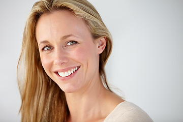 Image showing Portrait, smile and mature woman in studio with natural beauty for break, rest and confident personality on white background. Face of happy model with good mood, pride and optimism at mockup space