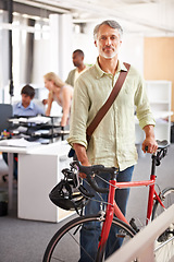 Image showing Mature man, business and bicycle in office with portrait and manager of sustainable company. Ceo, boss and job with eco friendly commute in morning with smile in a creative agency of a professional