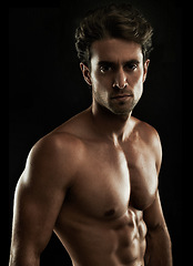 Image showing Topless, black background or portrait of man for bodybuilding results, six pack or stomach in studio. Fitness model, dark or ripped person with healthy body, abs or muscle for wellness in Italy