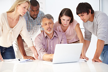 Image showing Business people, planning and teamwork on laptop for website design collaboration, manager feedback and advice. Group meeting, mature boss and creative designer team on computer or software training