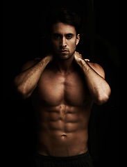 Image showing Six pack, black background or portrait of model for workout, training or exercise in studio for fitness. Man, dark or ripped male person with healthy body, abs or stomach for wellness in Italy