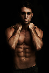 Image showing Six pack, black background or portrait of man for workout, training or exercise in studio for fitness. Model, dark shadow or ripped male person with healthy body, abs or stomach for wellness in Italy