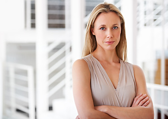 Image showing Portrait, serious and a business woman arms crossed in her professional office for company management. Corporate, workplace and a confident a mature CEO, manager or boss with a development mindset