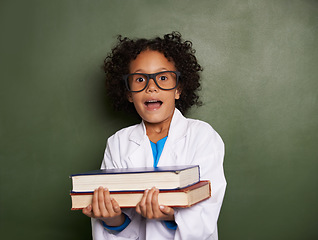 Image showing Child, surprise and portrait with books by chalkboard for education stress, science learning and physics knowledge. African kid or student shocked or wow for school, scholarship fear and classroom